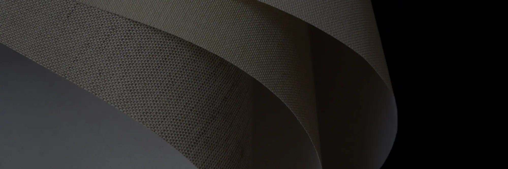 Close-up of binding materials including books and fabric for bookbinding projects.