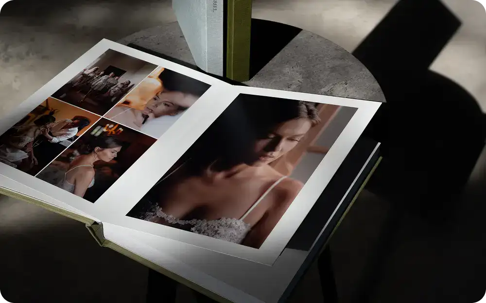 Open photo album with various images, including a close-up of a woman’s face.