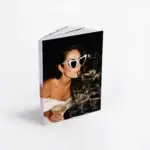 Woman with heart-shaped sunglasses at bridal shower with champagne glasses.