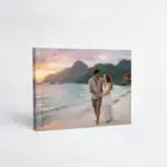Romantic couple on beach at sunset, honeymoon photo album cover.