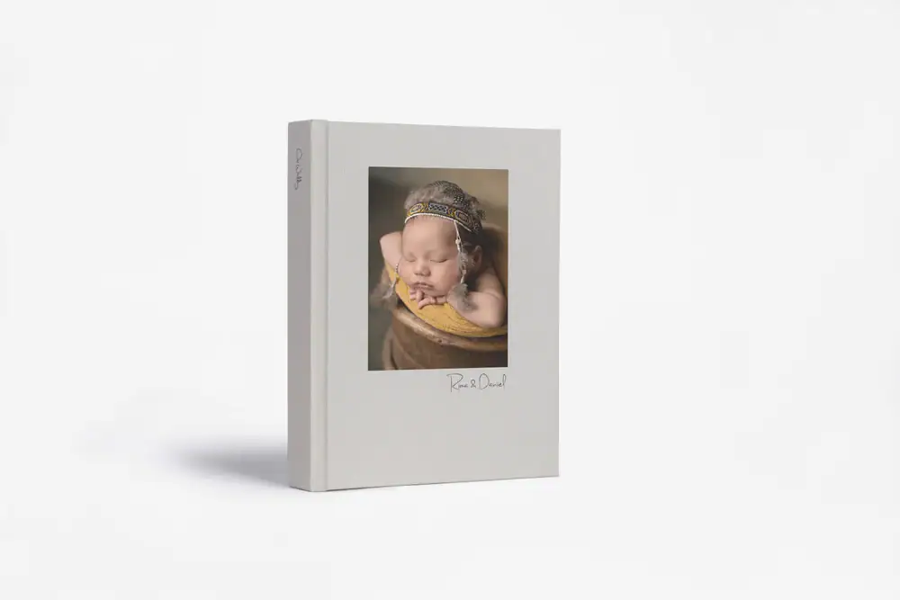 Baby sleeping in a cozy blanket, perfect for maternity and newborn memories.