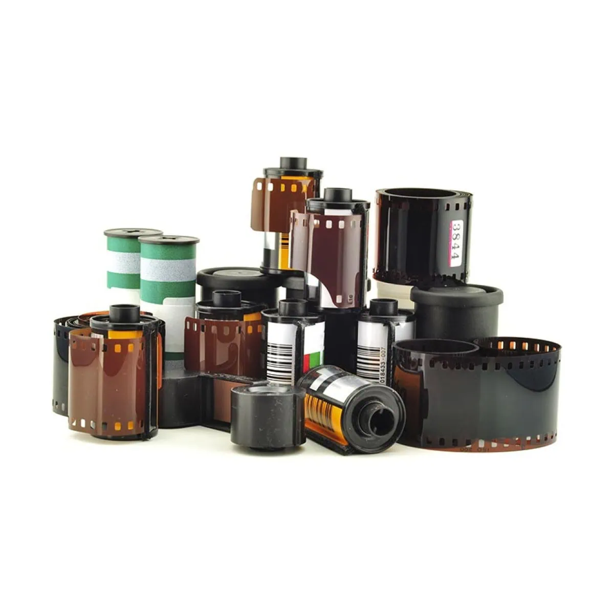 Collection of film reels and canisters for photography and film development.